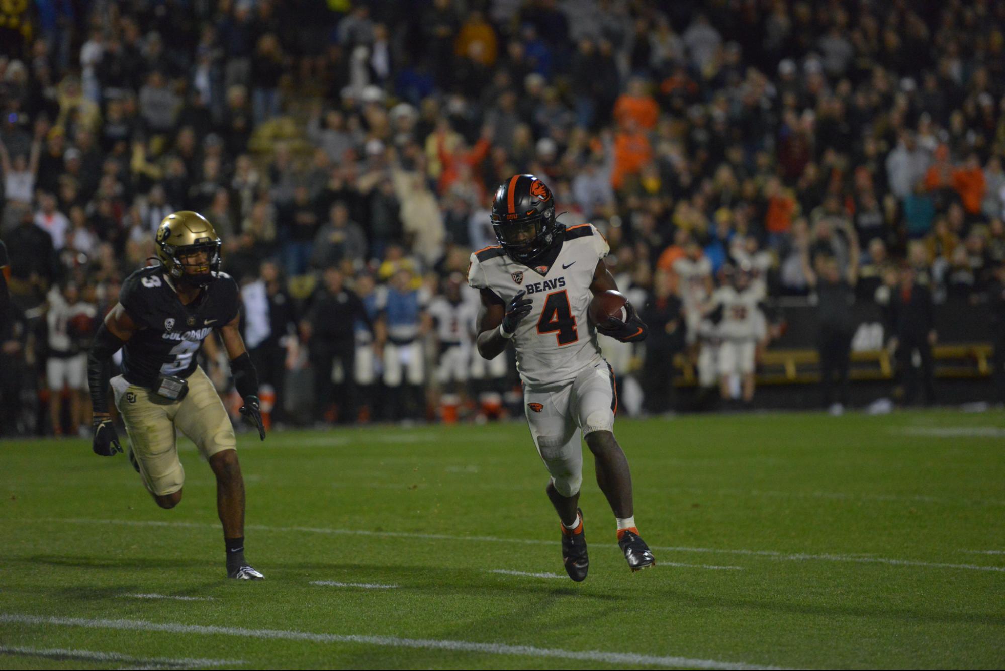 B.J. Baylor runs the ball past Christian Gonzalez The Bold