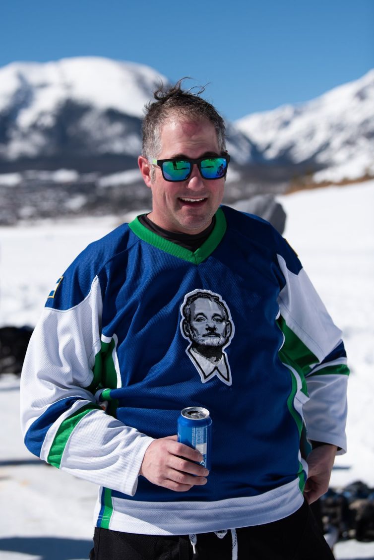 Tom Young of team BFM drinks a beer after his last match at the