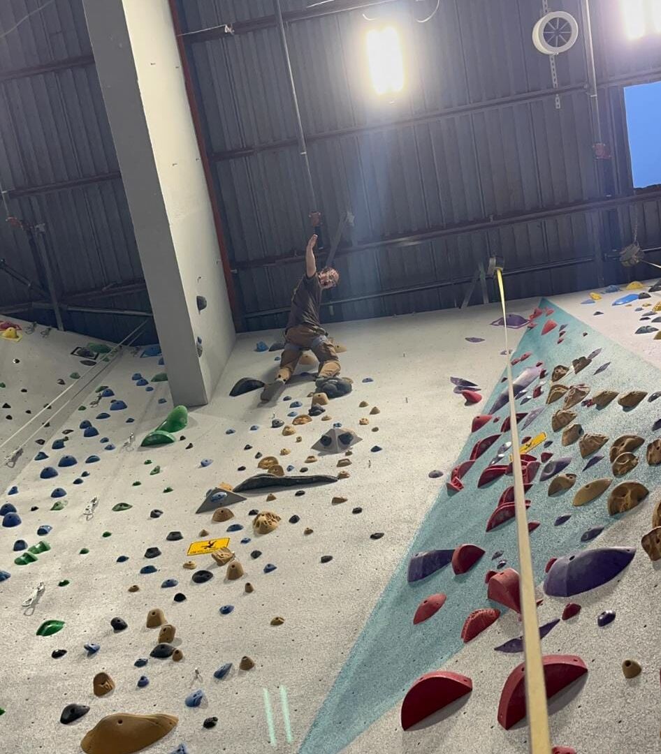Climbing Wall Brian Chambers reaches the top of an indoor rock climbing wall at Colorado Springs City Rock on July 26, 2026. (Photo By Gean Chambers)