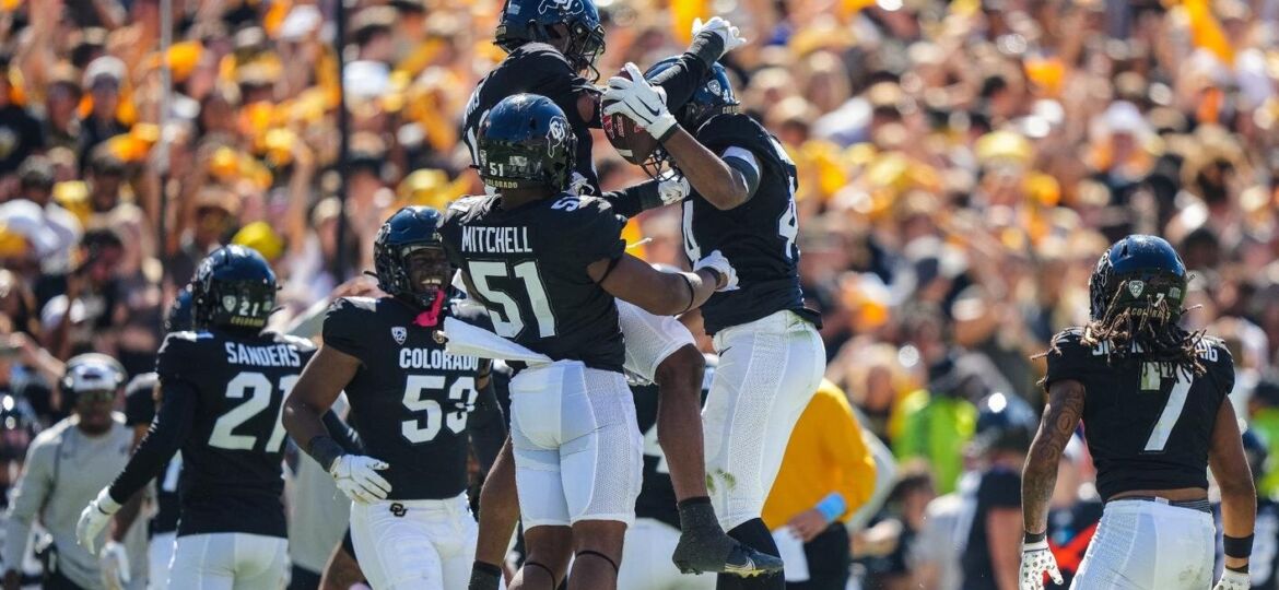 Buffaloes defense celebrate fumble recovery (cubuffs.com/Neill Woelk)