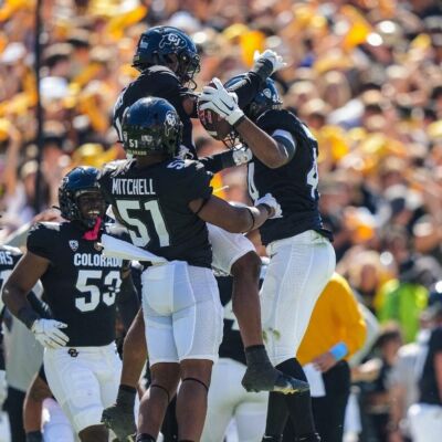 Buffaloes defense celebrate fumble recovery (cubuffs.com/Neill Woelk)