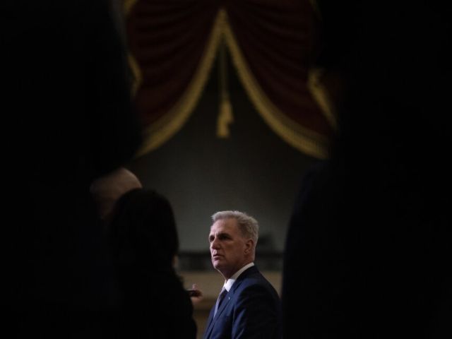 House Speaker Kevin McCarthy speaks to journalists flanked by fellow Republican members outside the House Chamber, at the U.S. Capitol on Tuesday, September 26, 2023.(Tom Brenner for The Washington Post via Getty Images)