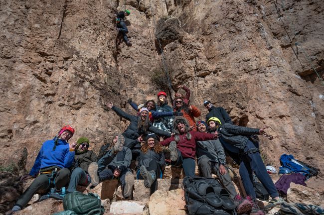 Members of Cruxing in Color and other affinity groups pose for a portrait at the end of a long day of climbing at the 2023 Craggin' Classic in Cañon City, CO on Oct. 28. (Nathan Thompson/CU News Corps)