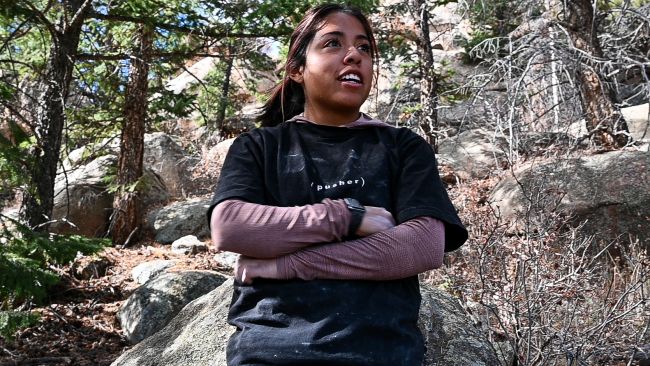 Anna Castro is interviewed during a bouldering session in Evergreen, CO on Nov. 5, 2023. She spent the afternoon working out the moves on a V8 boulder problem with friends. (Diana Boyer/CU News Corp)
