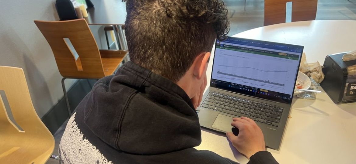 CU Boulder student Gabriel Ramirez peruses potential Roth IRA institutions and providers at the Center for Community, on March 4, 2024. (Ethan McGarvey, The Bold)