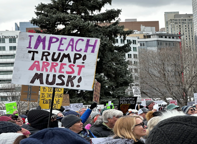 Protest signs at the "Hands Off" rally.