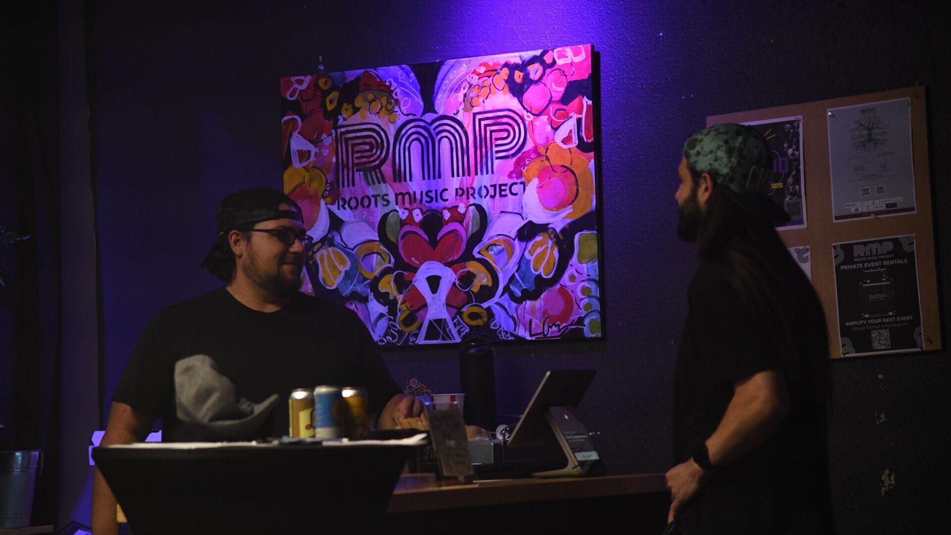 Roots Music Project Ian Steele, the Roots Music Project's director of production and IT, speaks with DJ Thomas Logan ahead of his set on Sept. 2, 2026, at Open Decks Night at Roots Music Project in Boulder, Colorado. (Photo by Liam Howard)