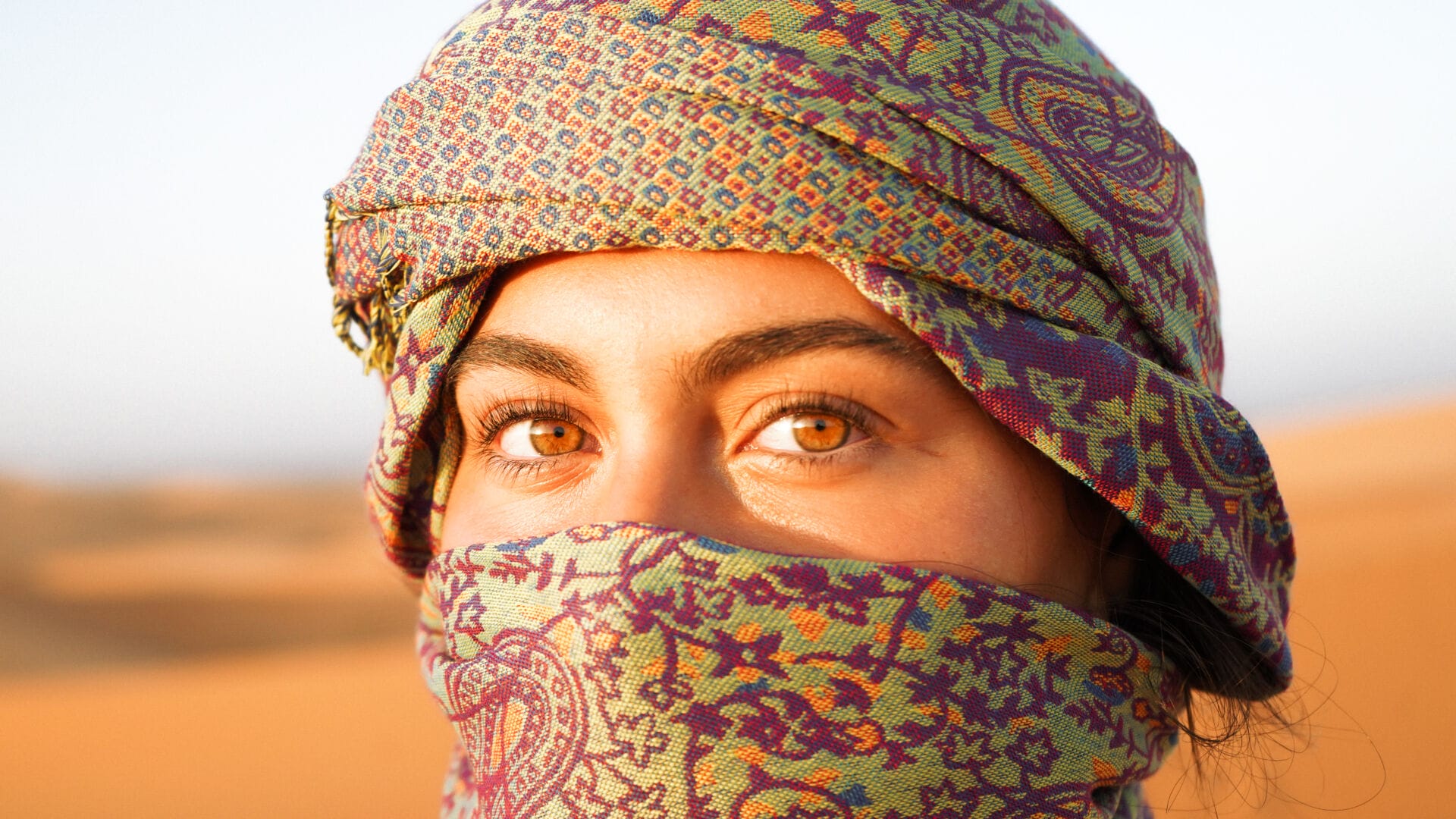 Hailey Giancola glances towards the camera while watching the sunrise in the Sahara Desert on Oct. 1, 2025, near Merzouga, Morocco. (Photo by Will King)