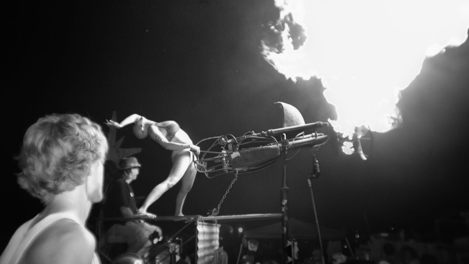 A dancer shoots pyrotechnic gun in front of a crowd at the Honey Pot Stage at Electric Honey Festival in Moab, Utah, on Sept. 26, 2026. (Photo by Will King)