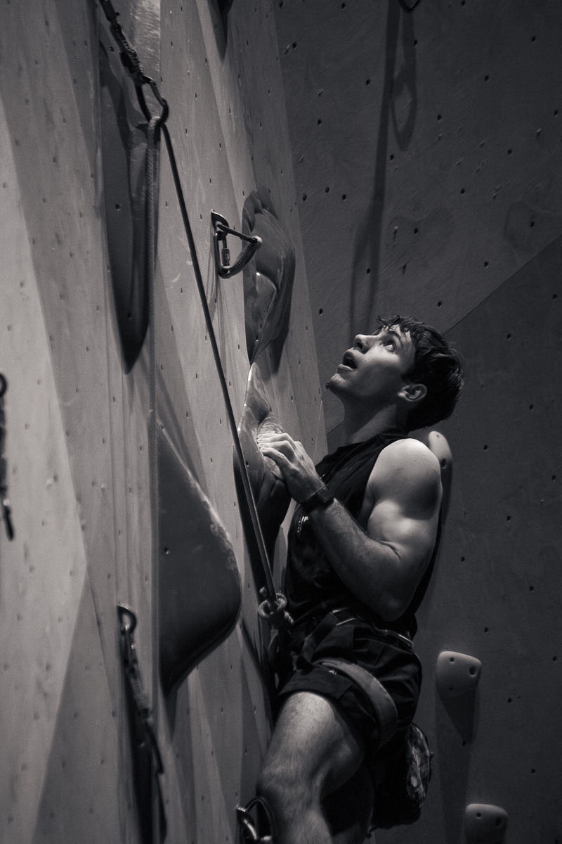 Harry Miller looks up, only to realize how much farther he has to go on the first men's climb at the Beast Fingers League (BFL) climbing competition at Longmont Climbing Collective in August 2026. (Photo by Harley Parsons)